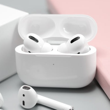 Apple AirPod Pros on a grey background |