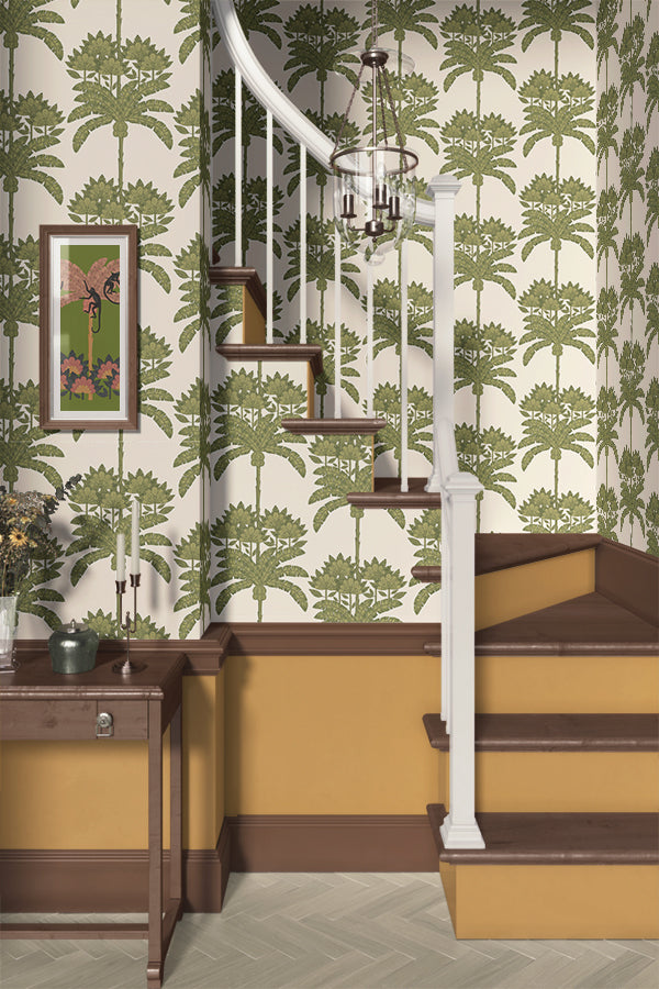 Staircase with green floral tropical wallpaper and a wooden side table.