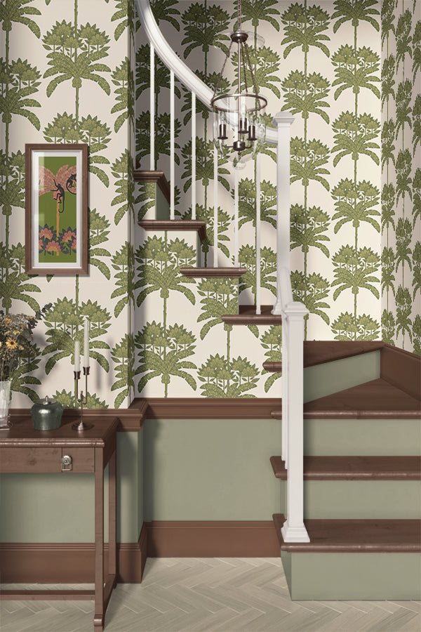Staircase with green floral tropical wallpaper and a wooden side table.