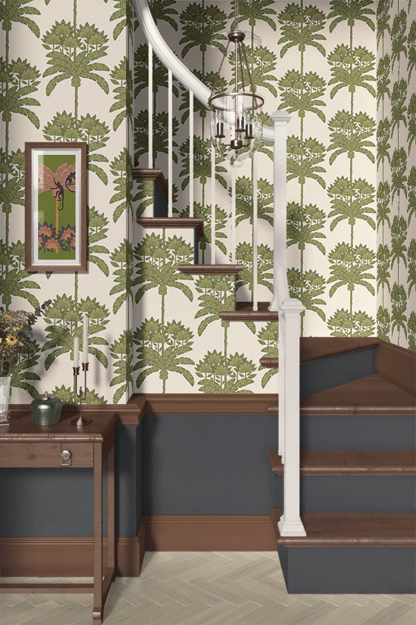 Staircase with green floral tropical wallpaper and a wooden side table.