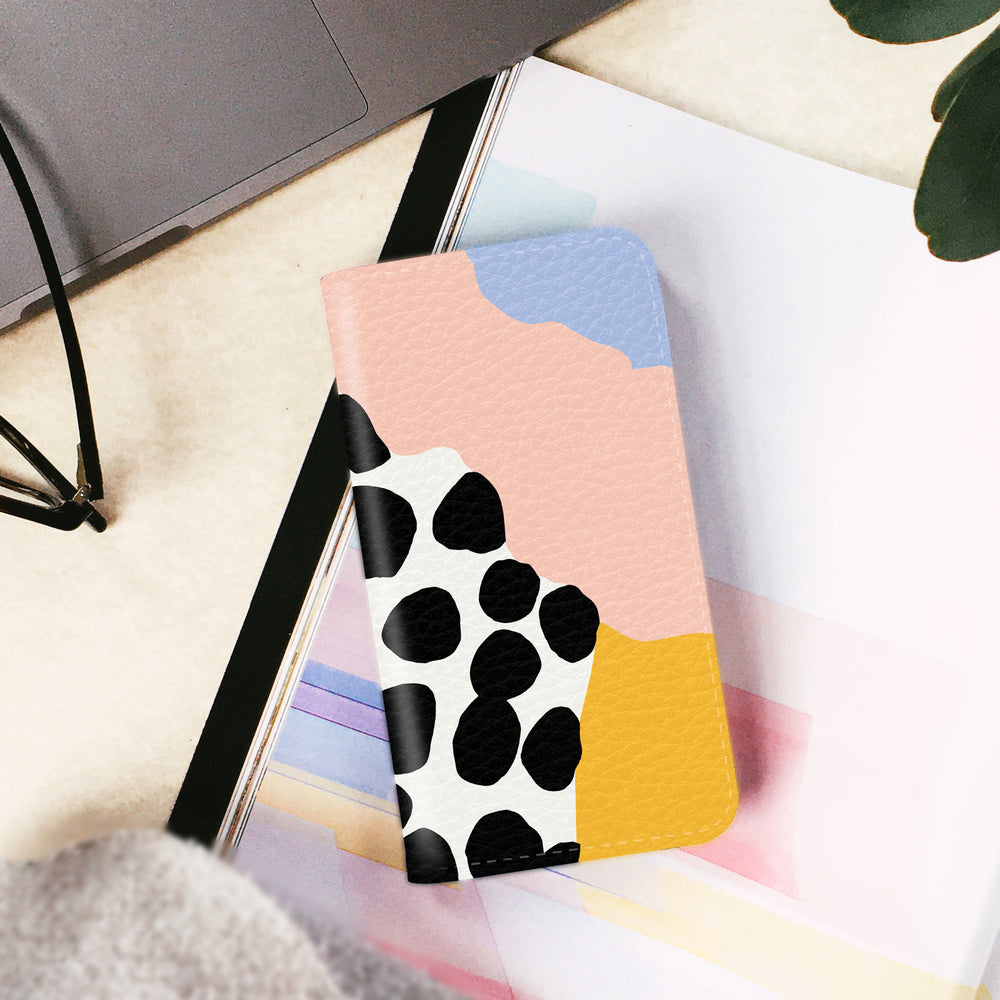 Pastel colours wallet phone case on a white table