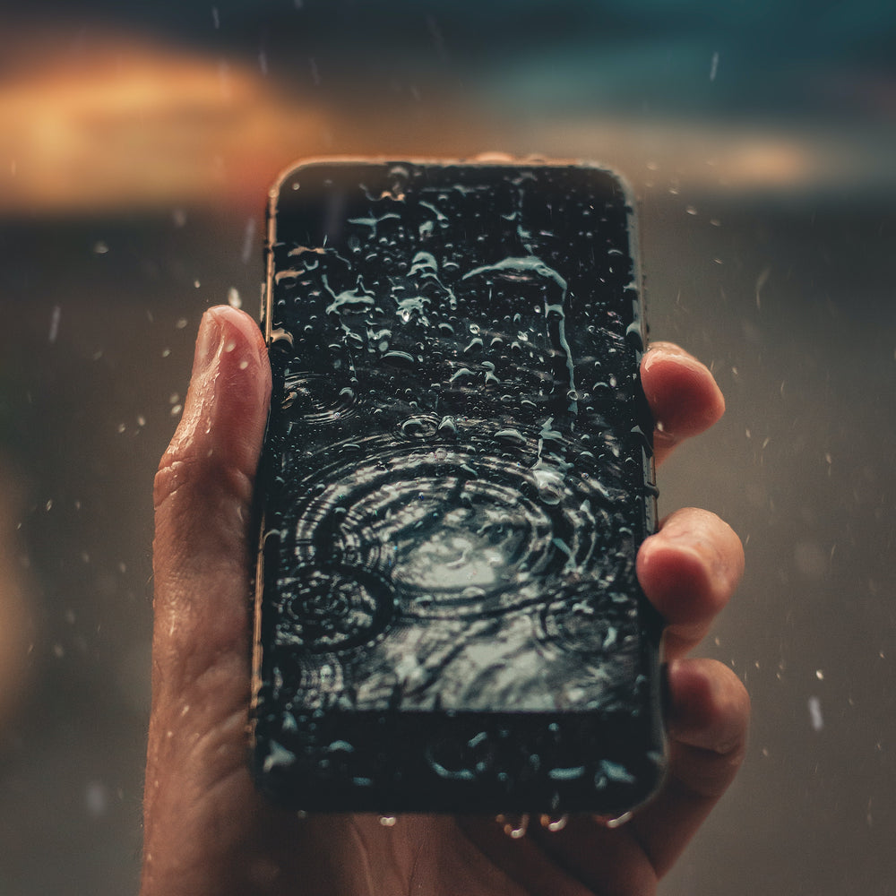 Photo of Person Holding Wet Smartphone