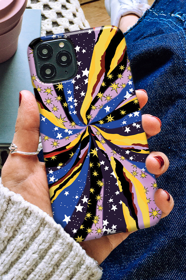 Person holding a phone with a colorful abstract phone case