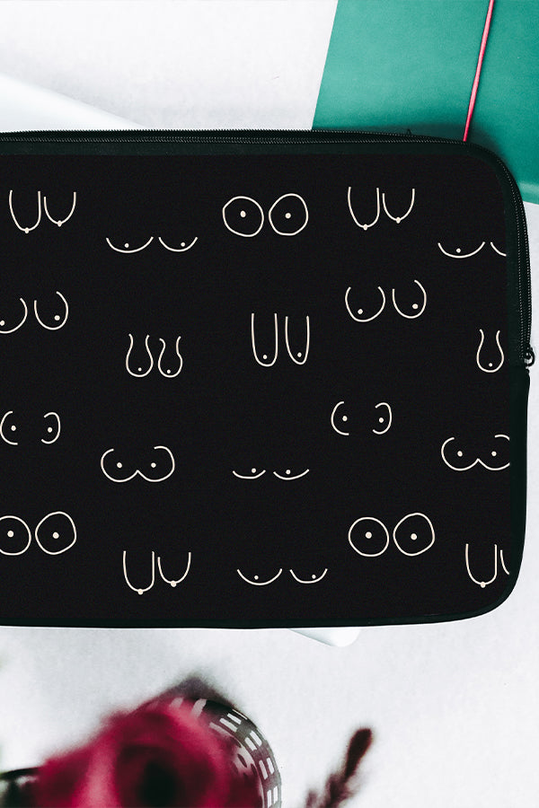 Black laptop sleeve with a white line art boob pattern
