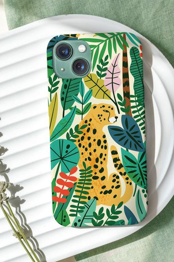 Phone case with a colorful leopard and jungle design on a white surface.