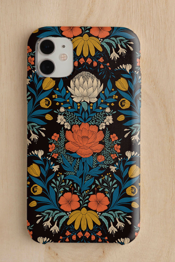 Phone case with a woodblock inspired floral design on a netural wood background