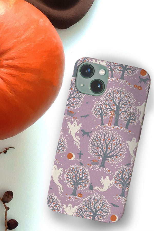 Purple phone case with a halloween themed designs with ghosts and trees