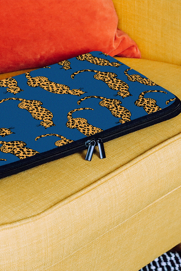 Blue laptop sleeve with an illustrated leopard design 