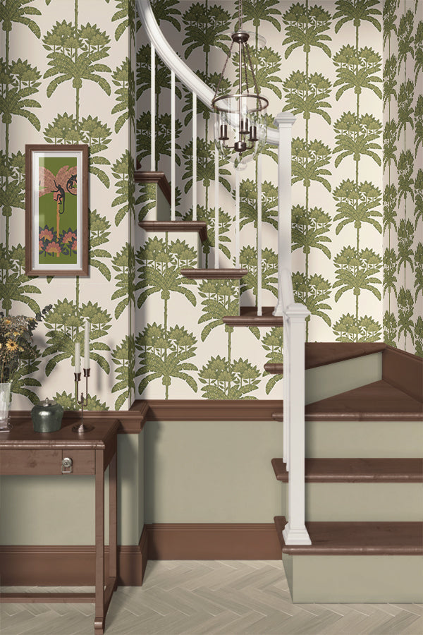 Staircase with green floral tropical wallpaper and a wooden side table.
