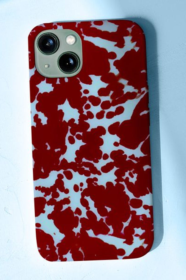 Phone case with a tortoise print pattern in red and blue