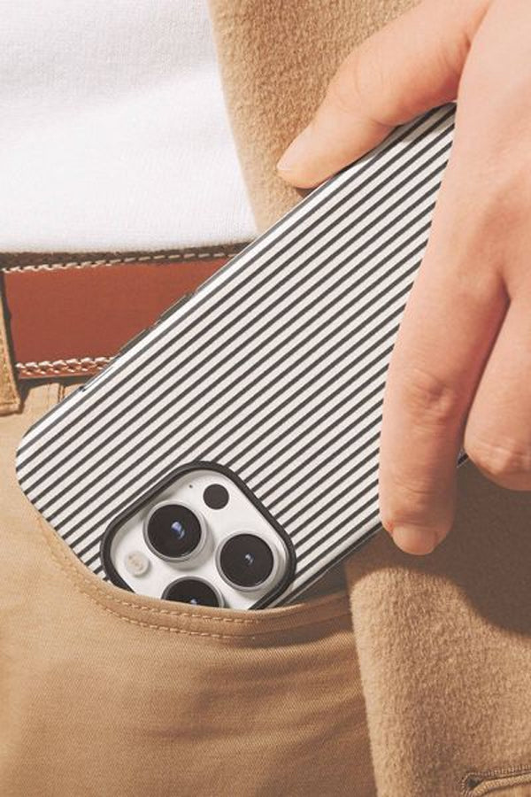 Phone case with striped pattern held in a pocket