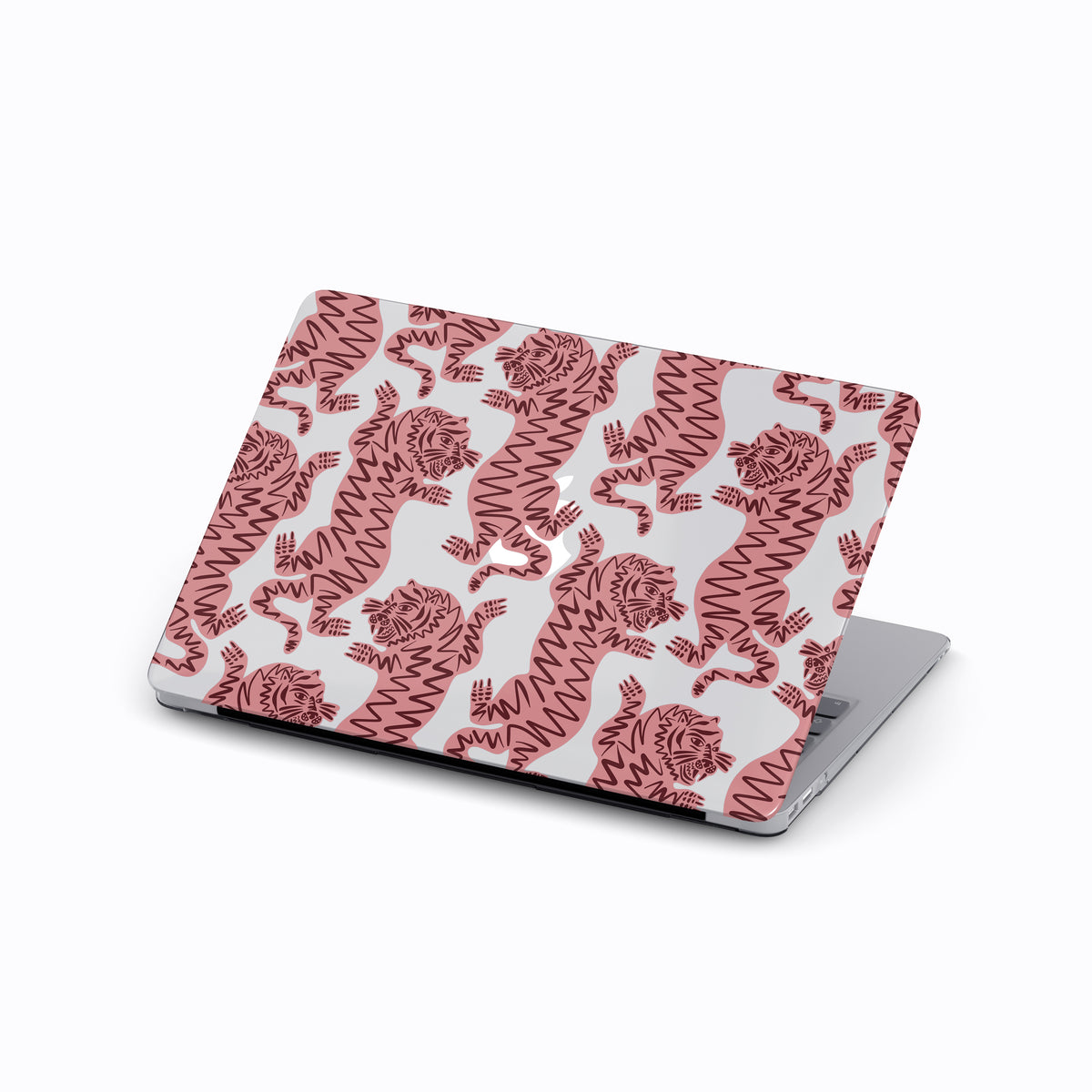 a laptop with a pink and white tiger patterned cover.