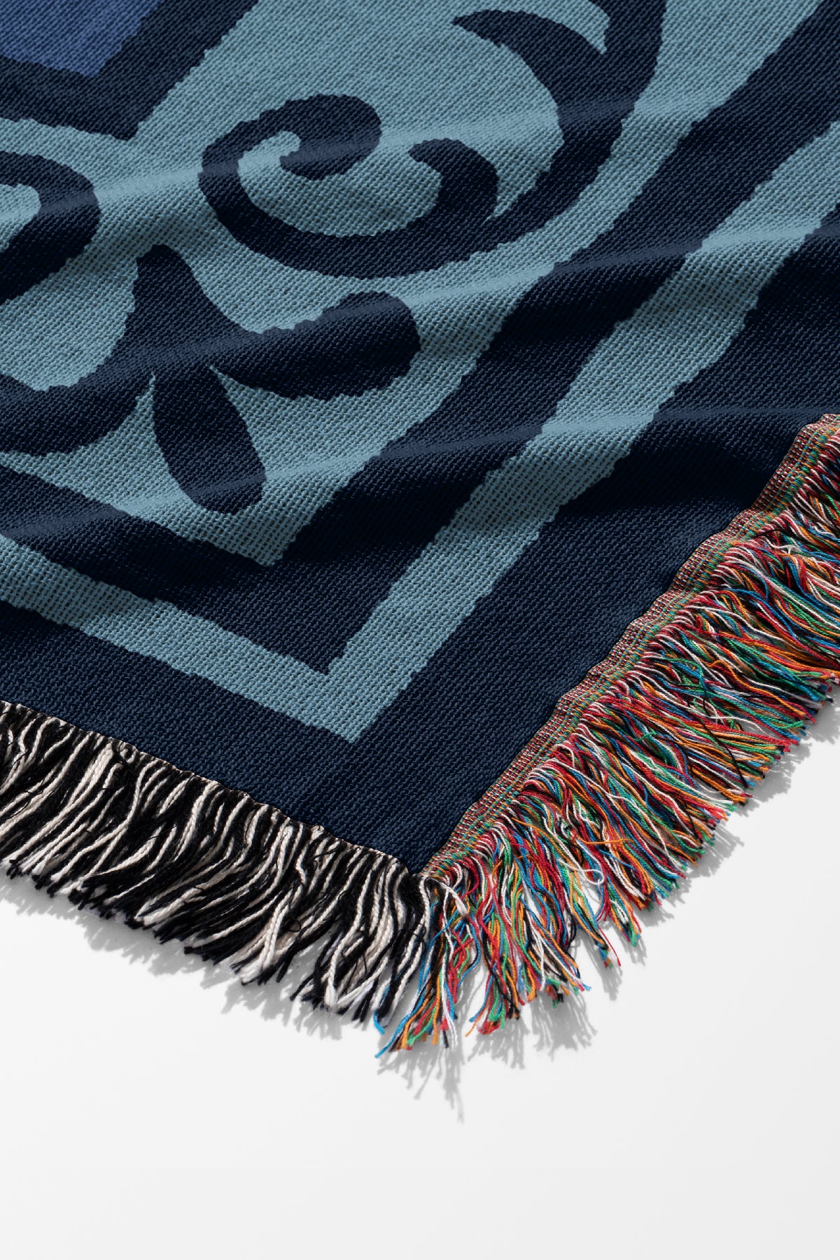 The resting cat jacquard woven throw blue blanket close up with of an ornate border and colourful frindge